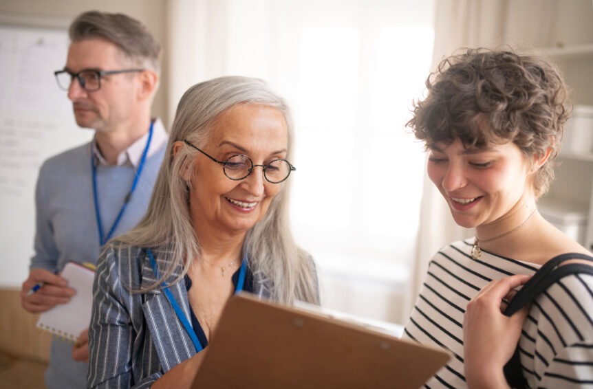 A family reviewing financial goals with a financial planner, illustrating SureWealth comprehensive financial planning services.