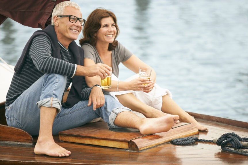 "A retired couple overlooking a scenic vista, symbolizing the peace and freedom of a financially secure retirement."