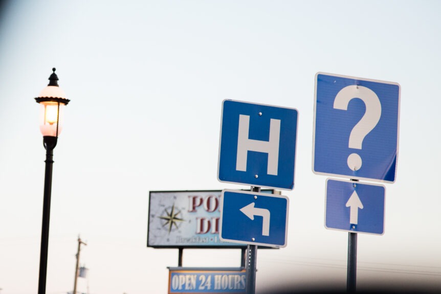 "A road with directional signs for Medicare options, representing the choices facing pre-retirees."